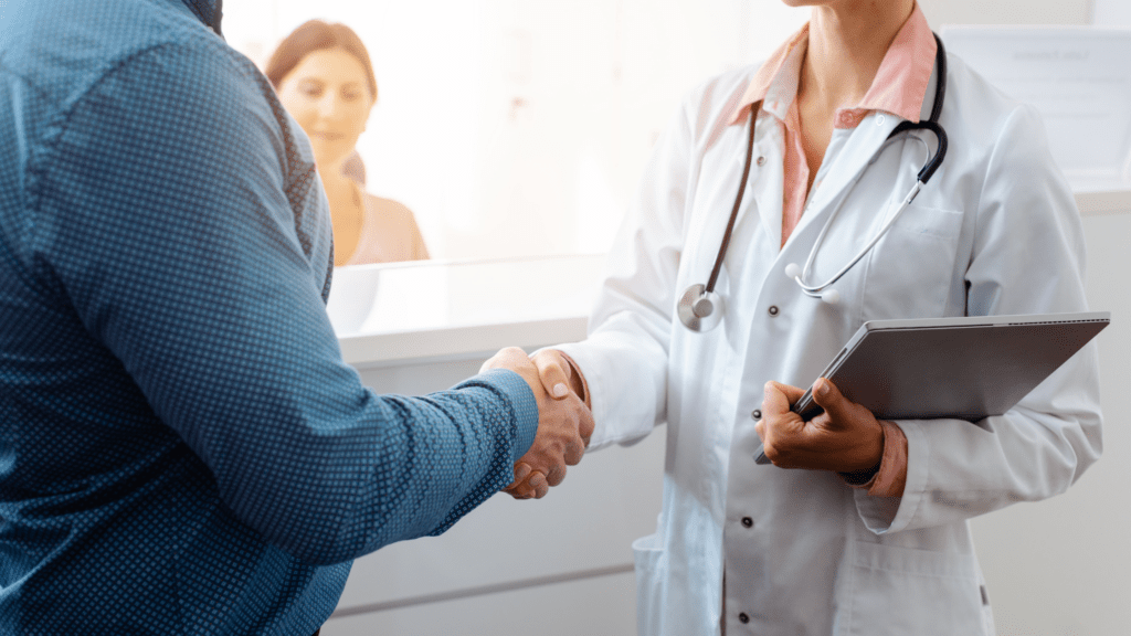 Man shaking doctors hand