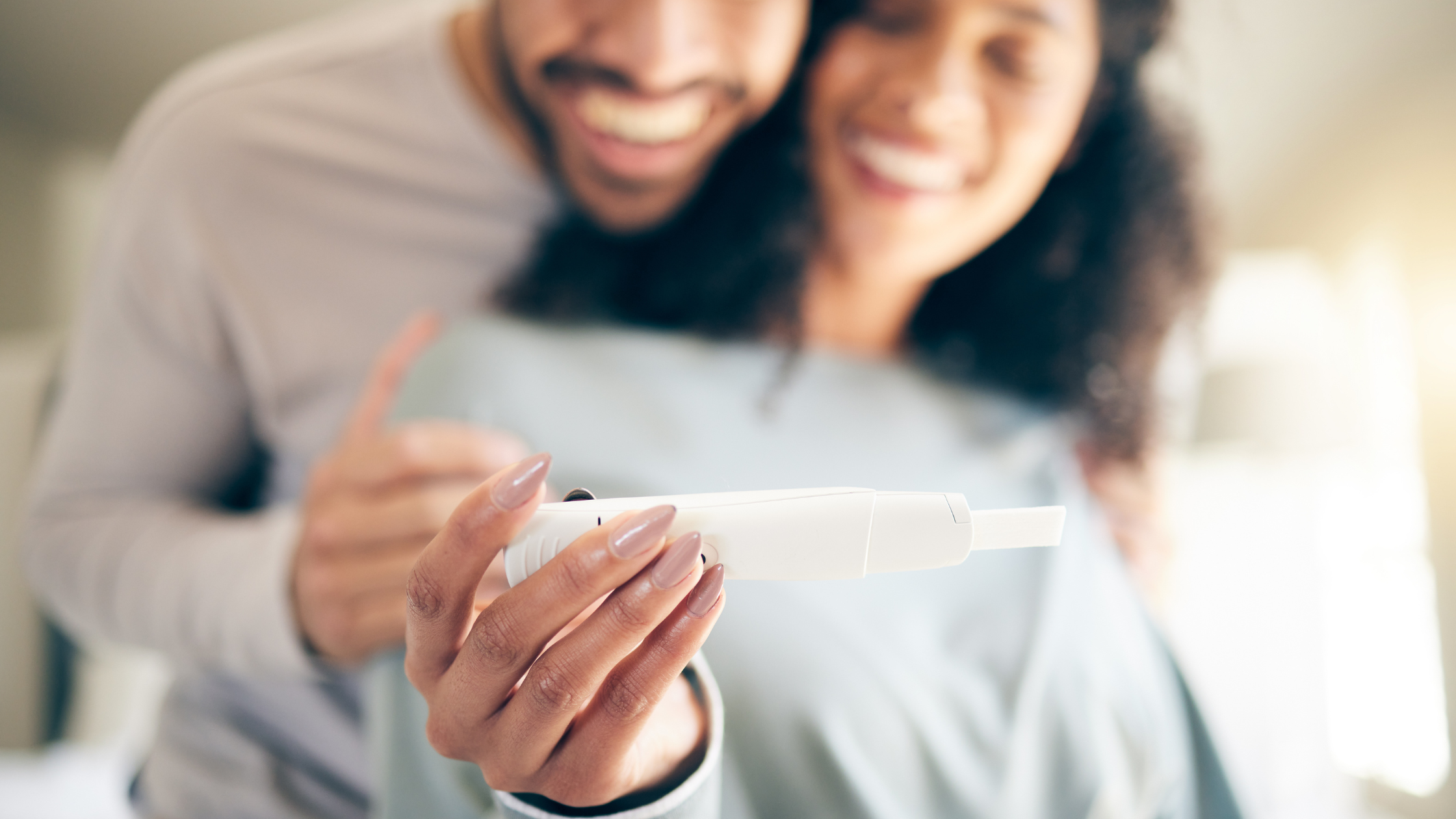 Couple looking at a pregnancy test