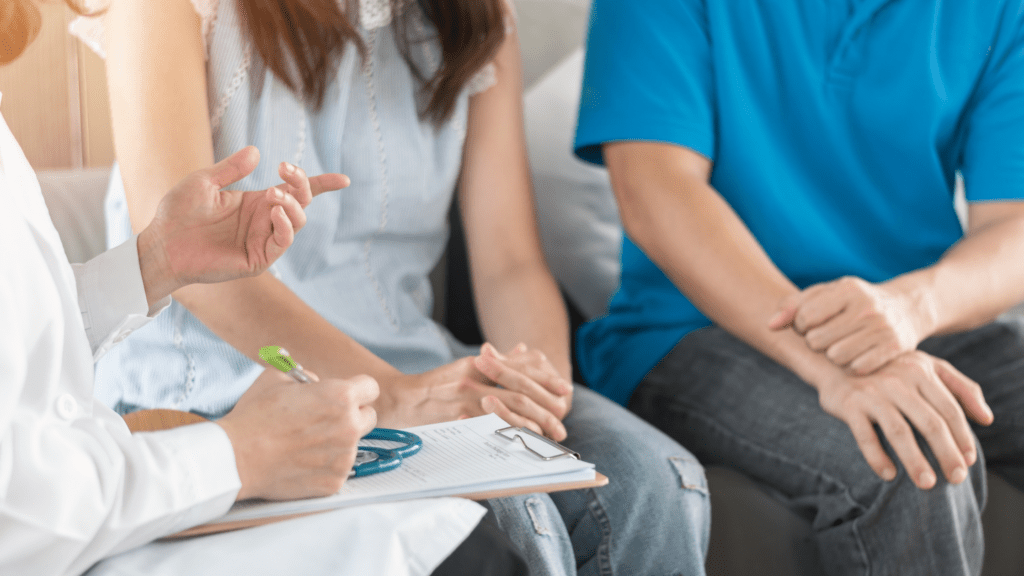 Couple speaking to a clinician