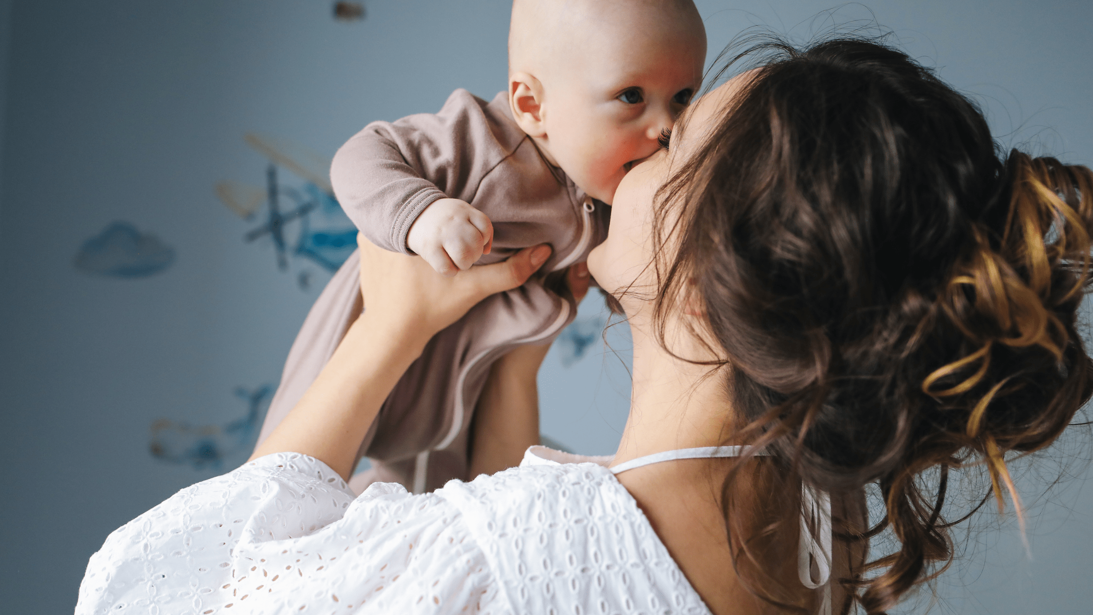 Mother and baby kissing